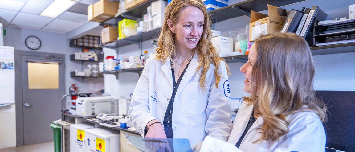 Two MSK researchers working in a lab. 