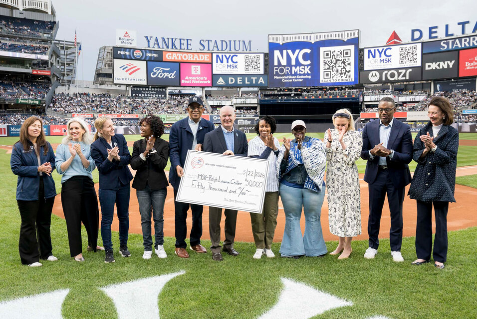 MSK President and CEO Dr. Selwyn M. Vickers and others during a check presentation on the field at Yankee Stadium.